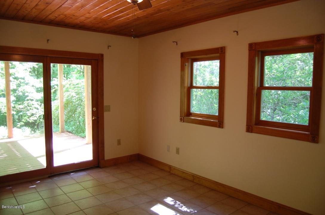 86 Leland Road Becket, MA 01223 - Photo 22 of 37 a view of an empty room with a window