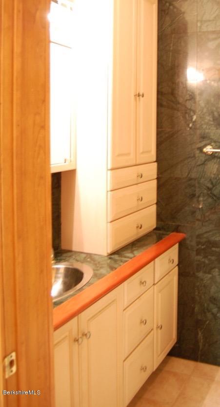 86 Leland Road Becket, MA 01223 - Photo 24 of 37 a bathroom with a sink and a mirror
