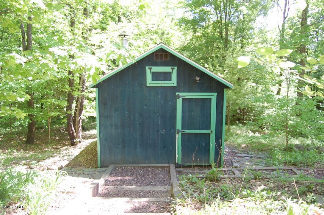 86 Leland Road Becket, MA 01223 - Photo 28 of 37 a front view of a house with garden