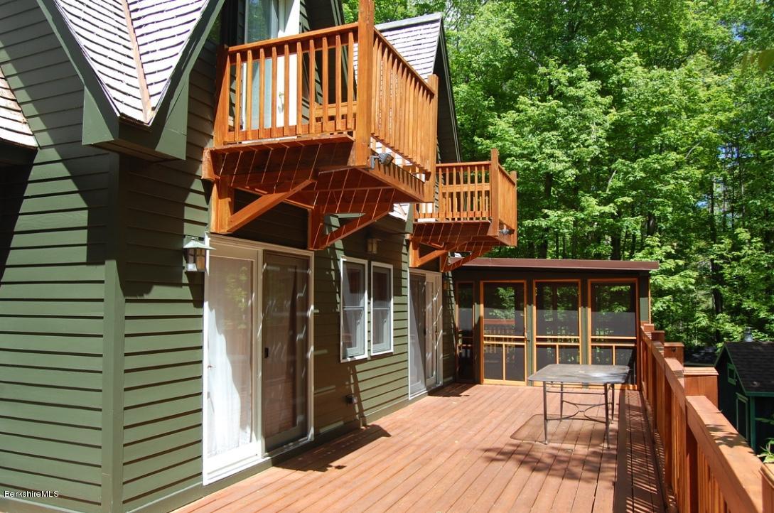 86 Leland Road Becket, MA 01223 - Photo 4 of 37 a view of a house with a balcony
