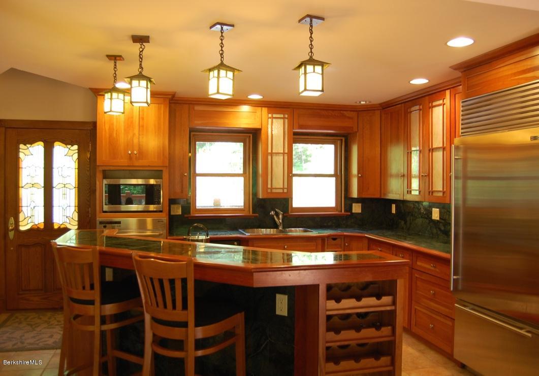 86 Leland Road Becket, MA 01223 - Photo 8 of 37 a kitchen with a counter space and stainless steel appliances