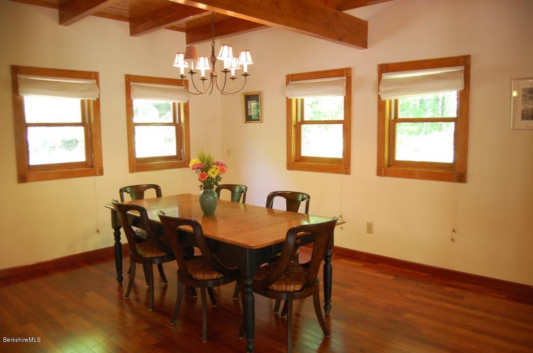 86 Leland Road Becket, MA 01223 - Photo 9 of 37 a view of a dining room with furniture and chandelier