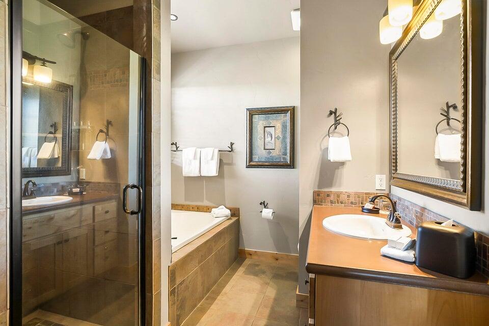 16845 South W Brasada Ranch Road, Unit 23 Powell Butte, OR 97753 - Photo 28 of 47 a bathroom with a tub sink and mirror