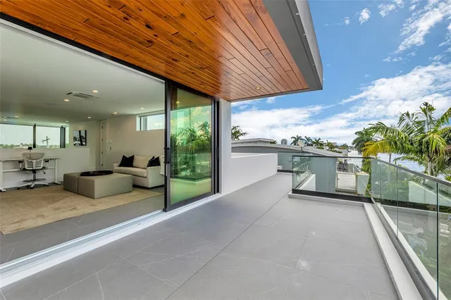 a spacious bedroom with a bed and a large window
