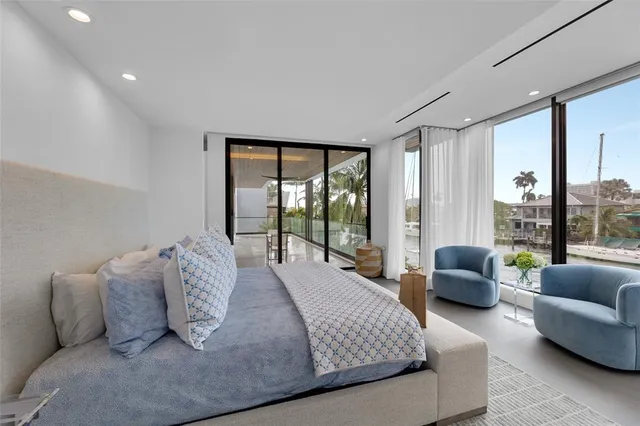 a bedroom with a bed and a couch