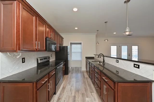 a view of a dining room with furniture and window