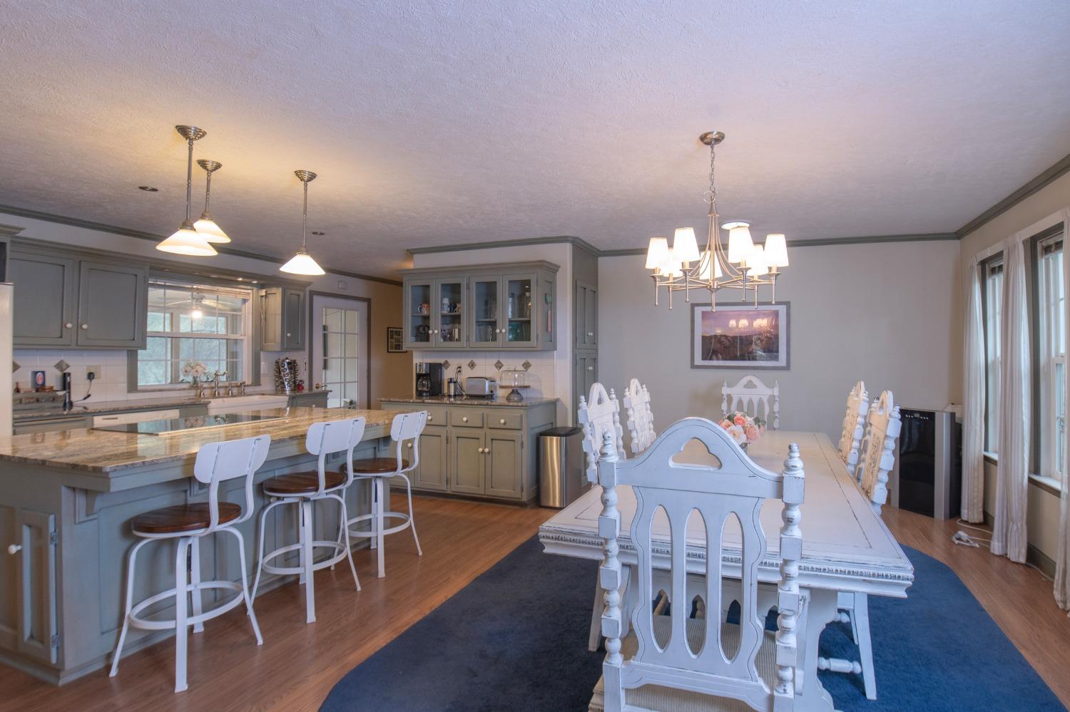 2695 Paso Pass Road Mariposa, CA 95338 - Photo 15 of 56 a view of a dining room with furniture wooden floor and chandelier
