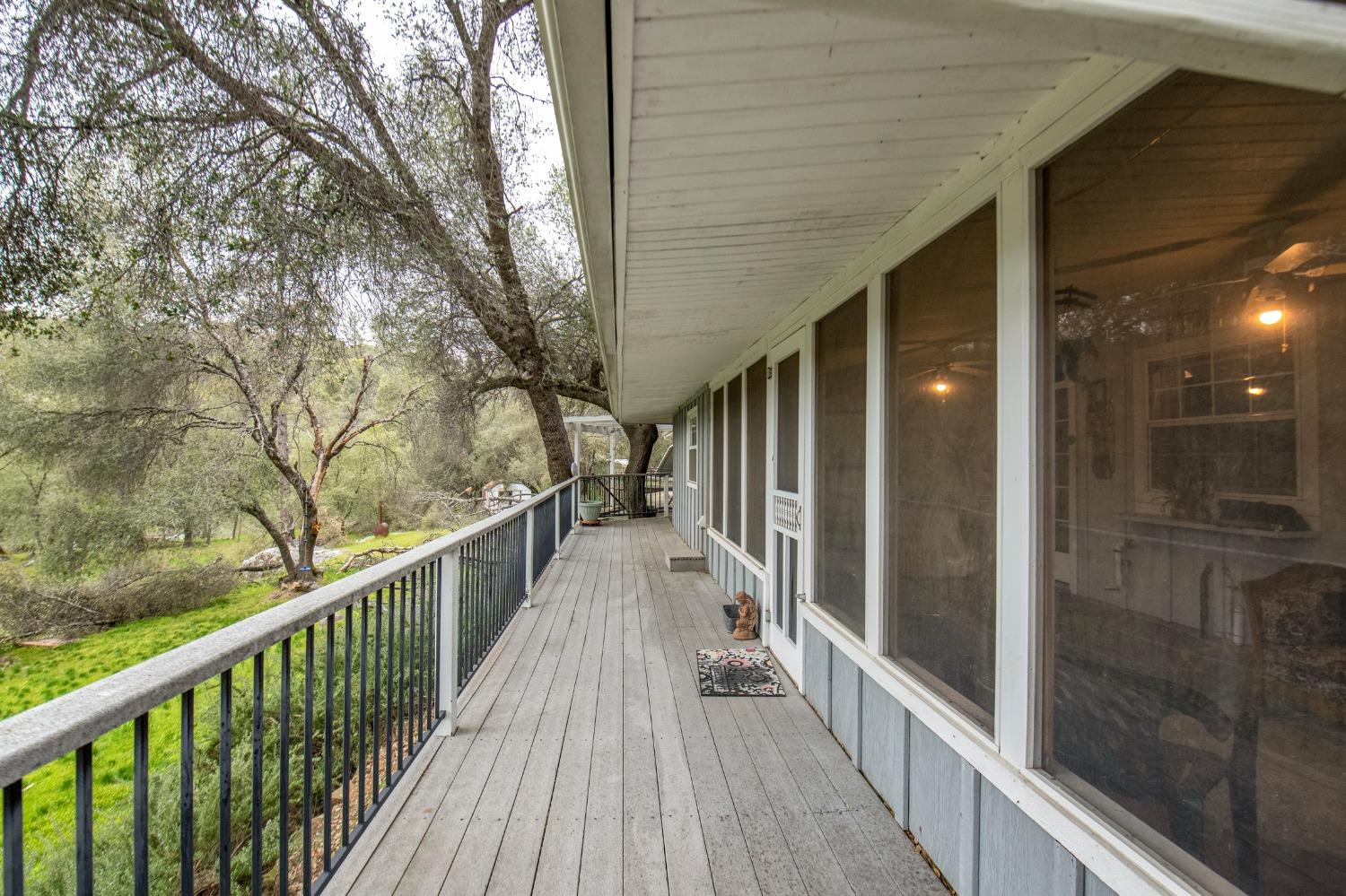 2695 Paso Pass Road Mariposa, CA 95338 - Photo 2 of 56 a view of a balcony with wooden floor