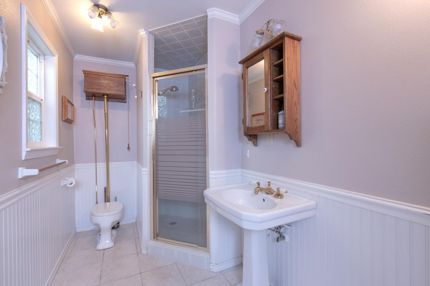2695 Paso Pass Road Mariposa, CA 95338 - Photo 29 of 56 a bathroom with a sink and a mirror