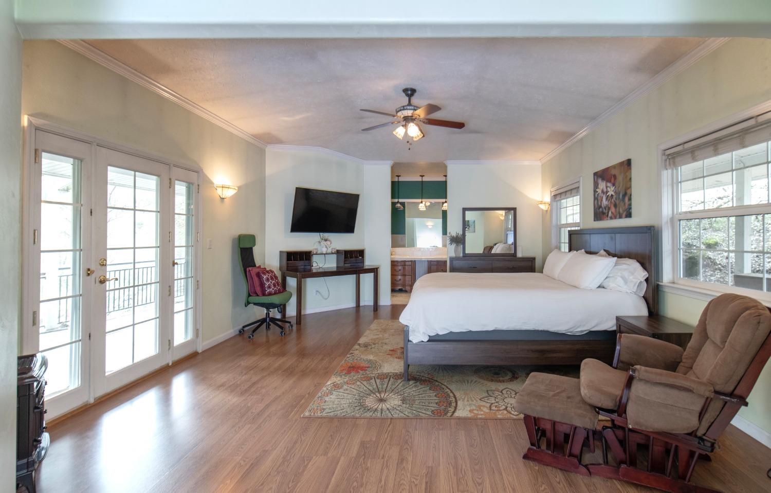 2695 Paso Pass Road Mariposa, CA 95338 - Photo 32 of 56 a bedroom with a bed window and a flat screen tv