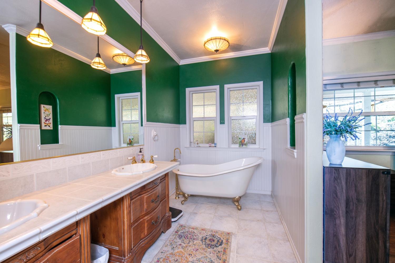 2695 Paso Pass Road Mariposa, CA 95338 - Photo 33 of 56 a spacious bathroom with a double vanity sink and a mirror