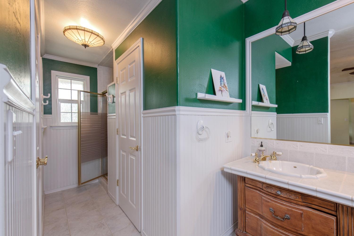 2695 Paso Pass Road Mariposa, CA 95338 - Photo 34 of 56 a bathroom with a sink and a mirror