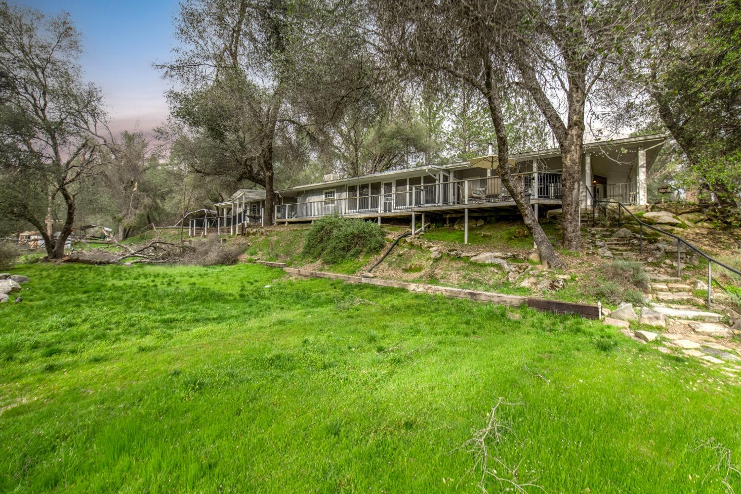 2695 Paso Pass Road Mariposa, CA 95338 - Photo 37 of 56 a view of house with swimming pool and garden