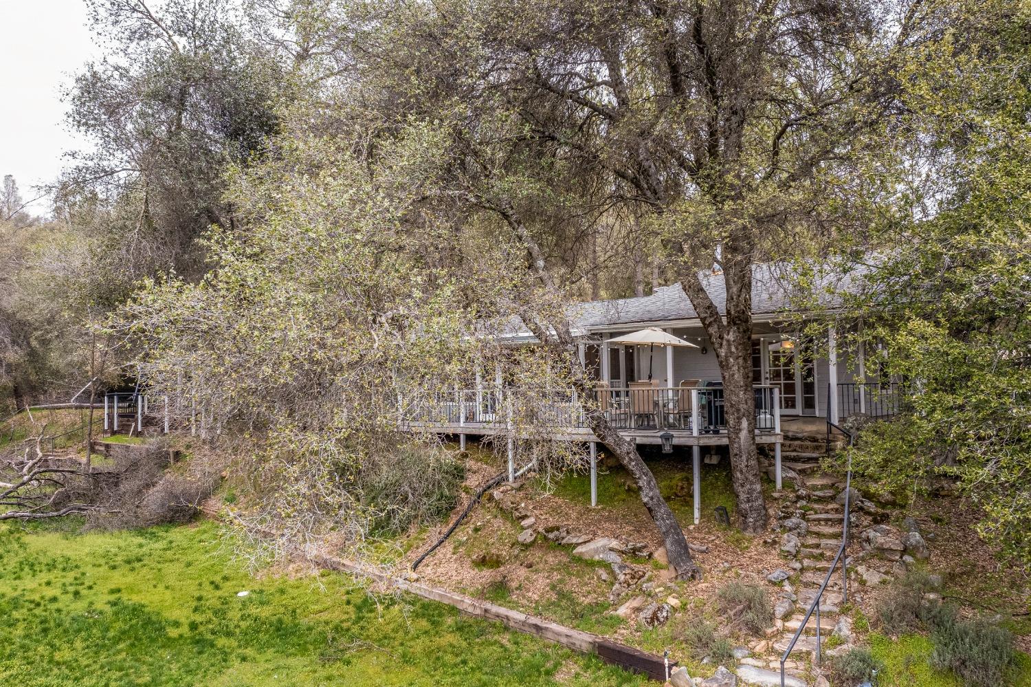 2695 Paso Pass Road Mariposa, CA 95338 - Photo 5 of 56 a view of a house with a yard and sitting area