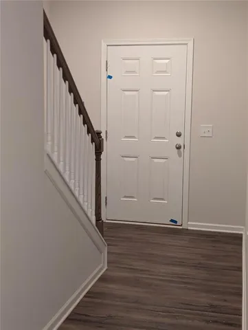 a view of entryway with wooden floor