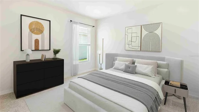 a bedroom with a bed and a dresser