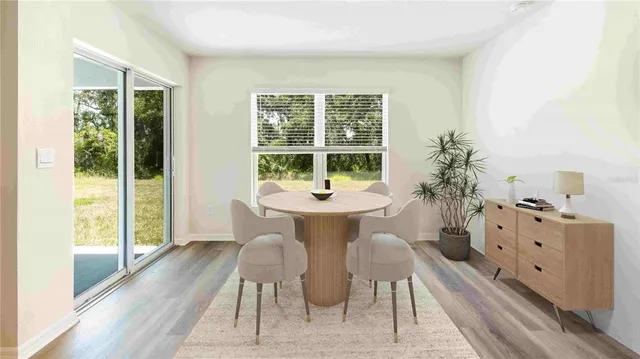 a view of a dining room with furniture window and outside view
