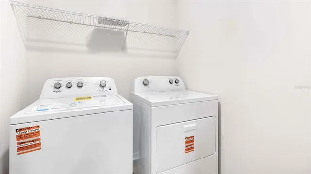 a utility room with dryer and washer