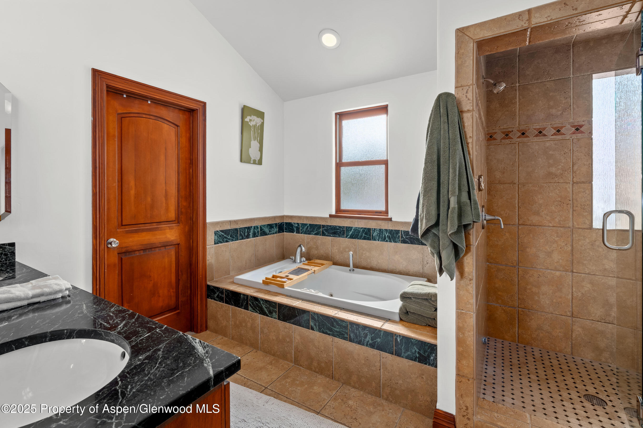 212 Juniper Court Basalt, CO 81621 - Photo 14 of 21 a bathroom with a tub and a sink