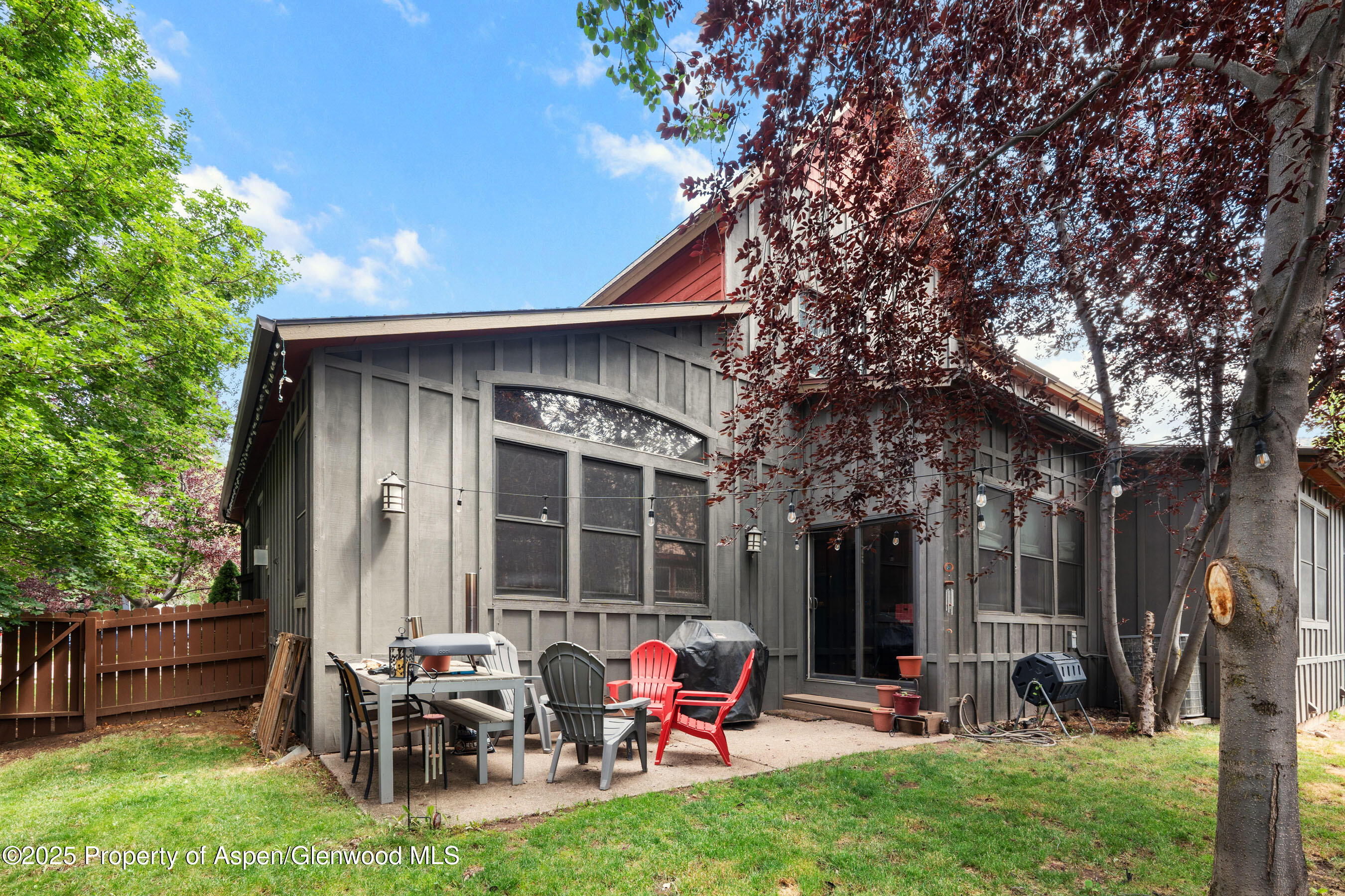 212 Juniper Court Basalt, CO 81621 - Photo 10 of 21 a backyard of a house with outdoor seating and trees
