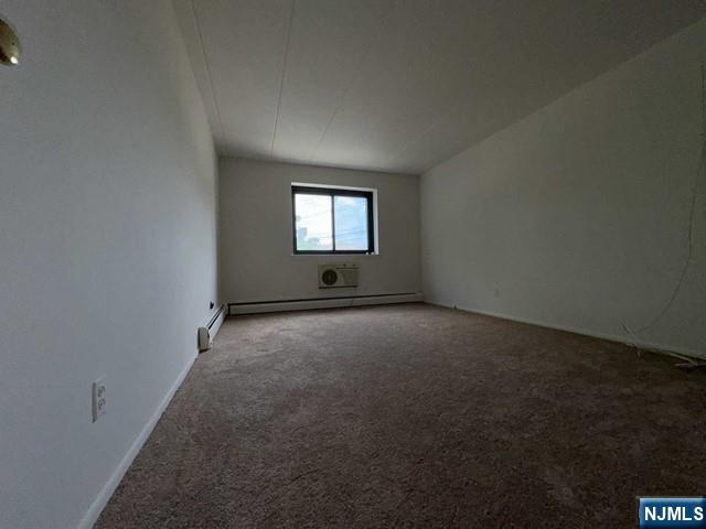 873 Main Street, Unit 3A Hackensack, NJ 07601 - Photo 12 of 15 an empty room with a window