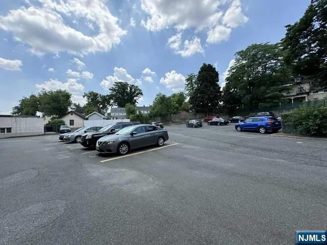 a view of car parked on the side of the road