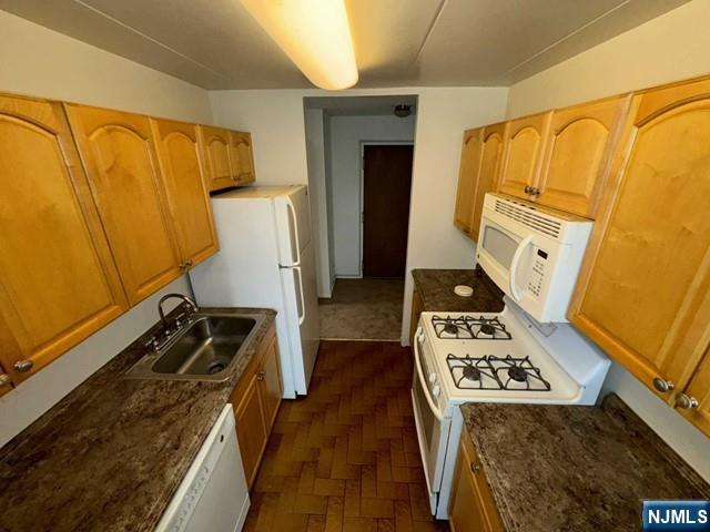 873 Main Street, Unit 3A Hackensack, NJ 07601 - Photo 8 of 15 a view of walk in closet with clothes and shoes