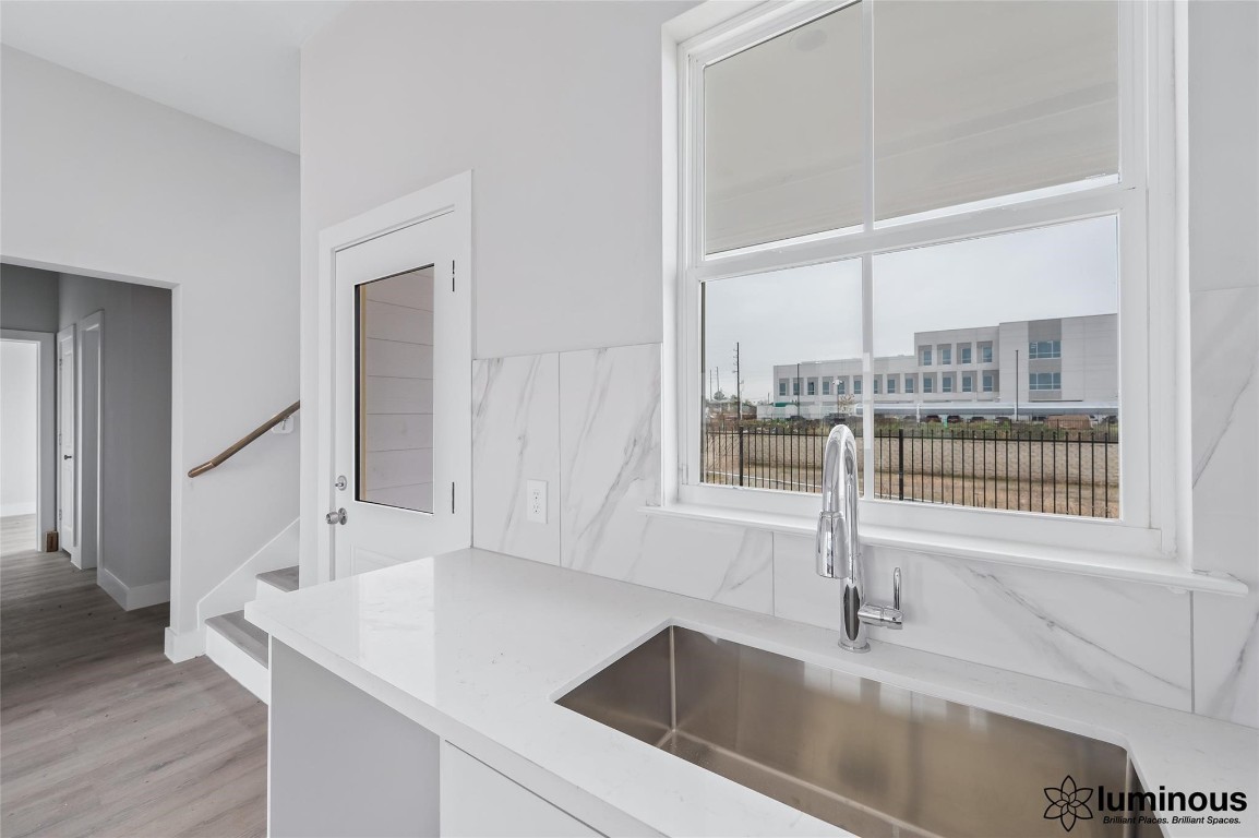 6702 Metro Boulevard, Unit 12 Houston, TX 77083 - Photo 11 of 22 a kitchen with a sink and a window