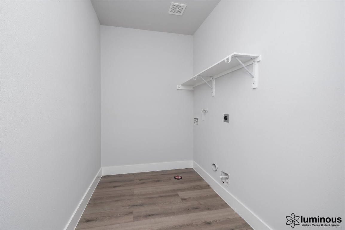 6702 Metro Boulevard, Unit 12 Houston, TX 77083 - Photo 17 of 22 a view of a room with wooden floor