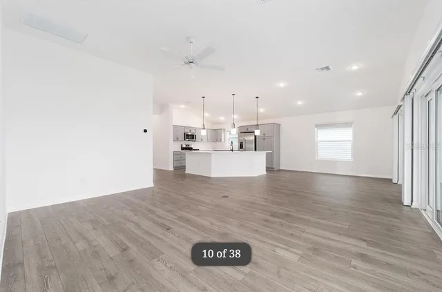 a view of a kitchen with a sink and a window