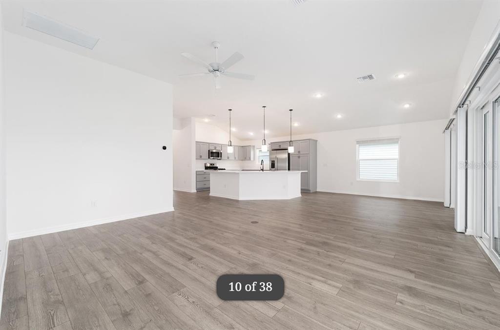 1917 Panlilio Loop The Villages, FL 34762 - Photo 3 of 11 a view of a kitchen with a sink and a window