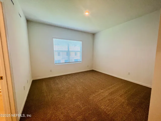 a bathroom with a sink a toilet a mirror and shower