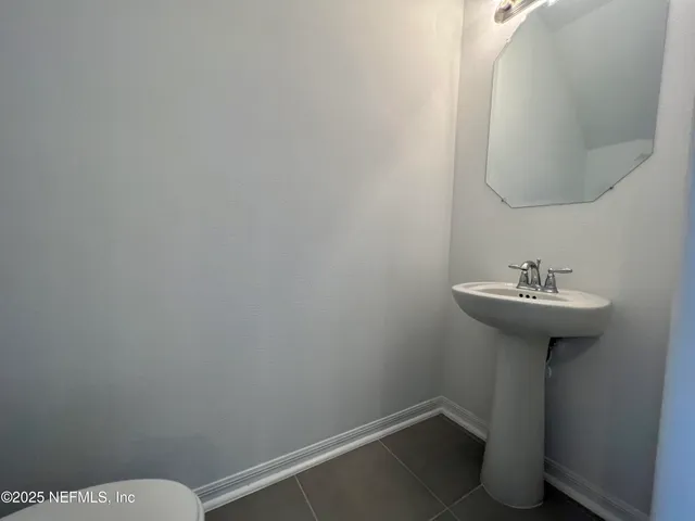 a bathroom with a sink toilet