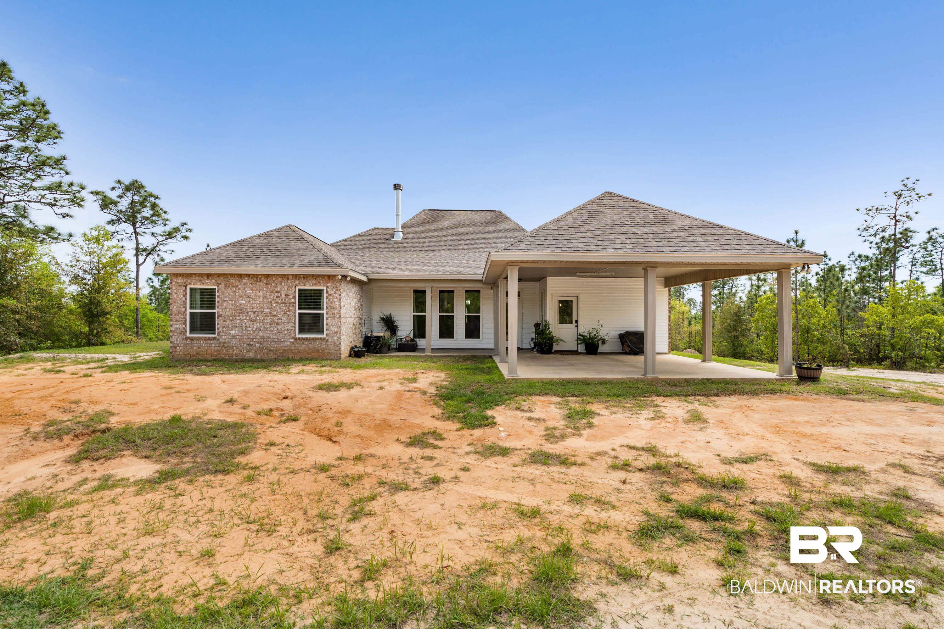7150 Powell Road, Unit LOT 6A Eight Mile, AL 36613 - Photo 21 of 35 Rear view of house with roof with shingles, brick siding, a patio area, and french doors