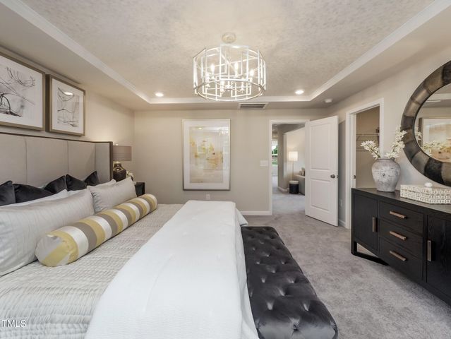 a bedroom with a bed and a table in it