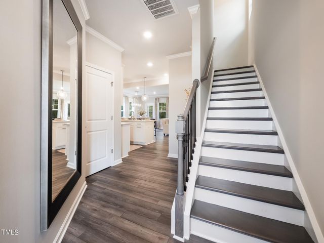 a view of entryway with wooden floor and stairs