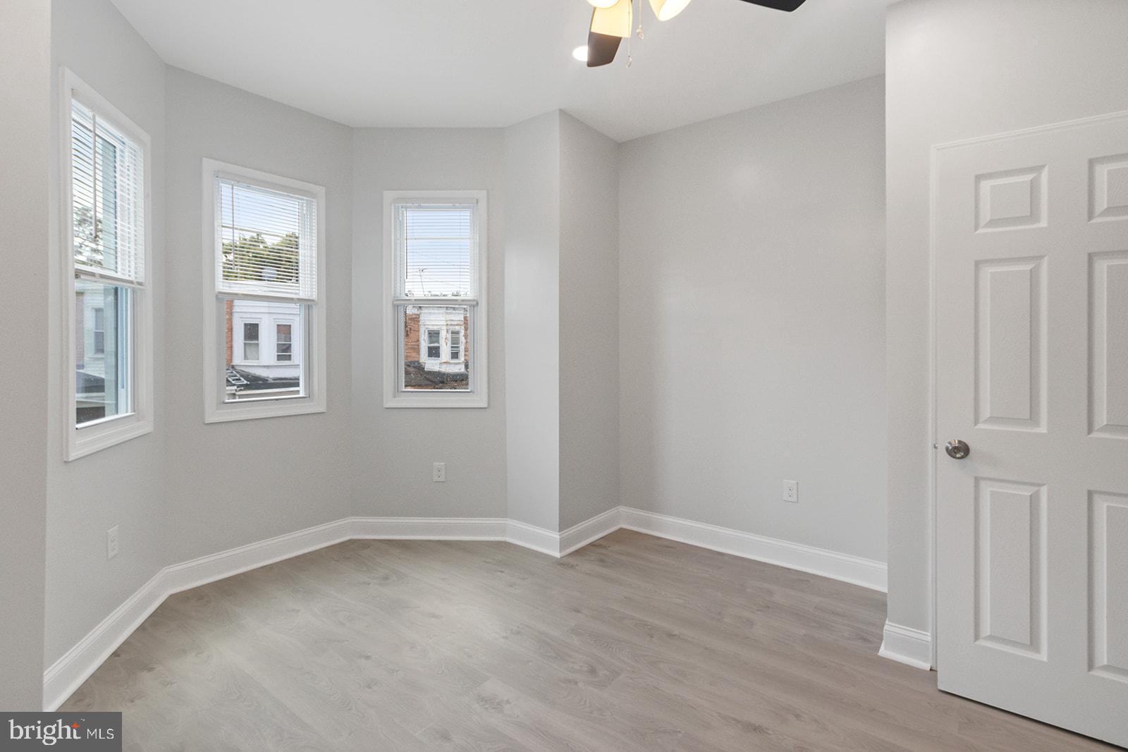 5213 Rodman Street Philadelphia, PA 19143 - Photo 17 of 31 a view of room with window and wooden floor