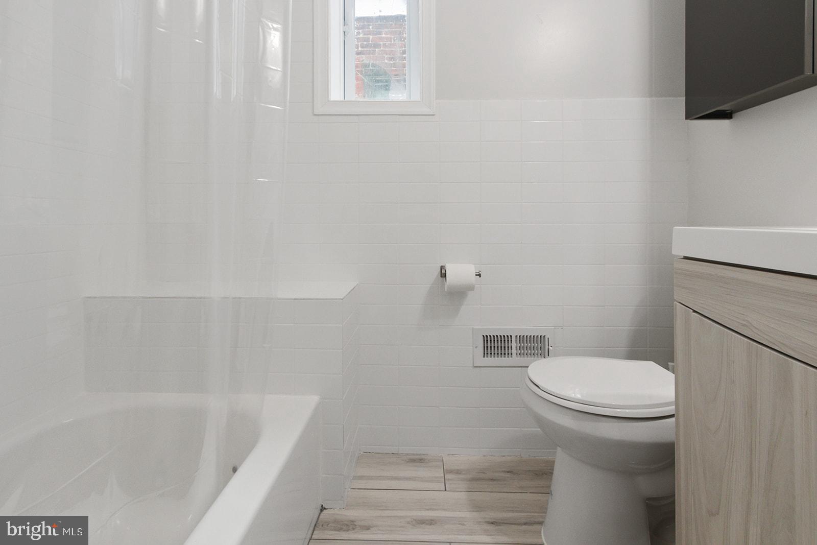 5213 Rodman Street Philadelphia, PA 19143 - Photo 24 of 31 a bathroom with a sink and a toilet