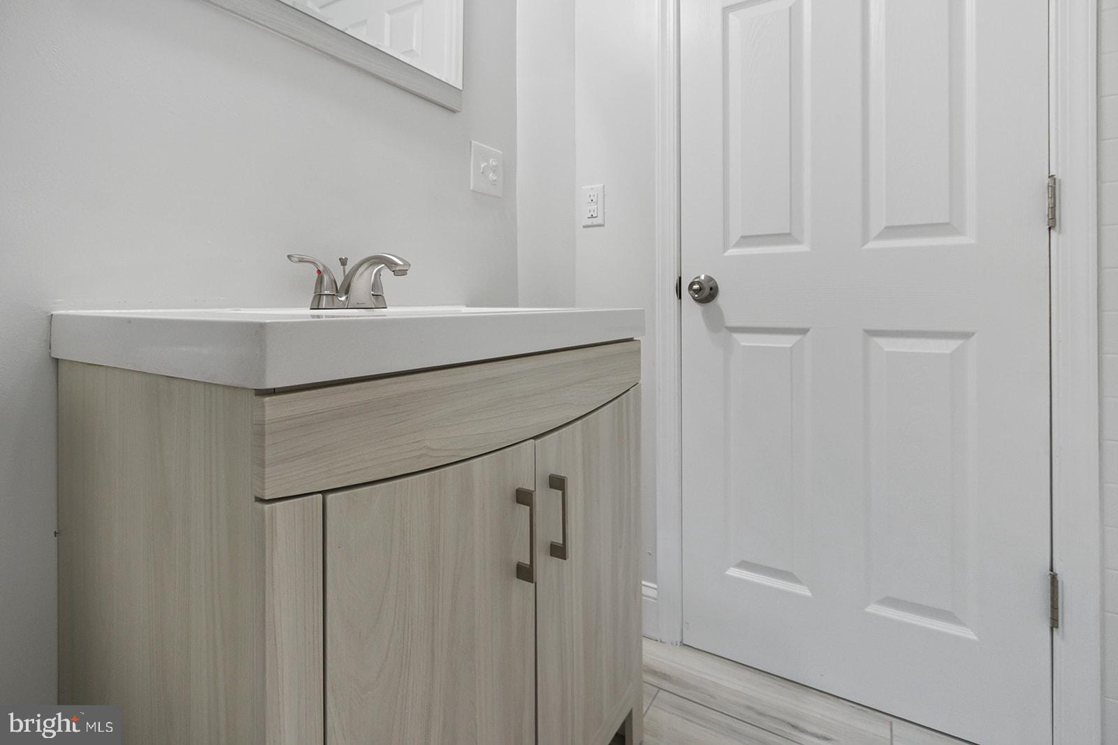 5213 Rodman Street Philadelphia, PA 19143 - Photo 25 of 31 a bathroom with a shower and a sink