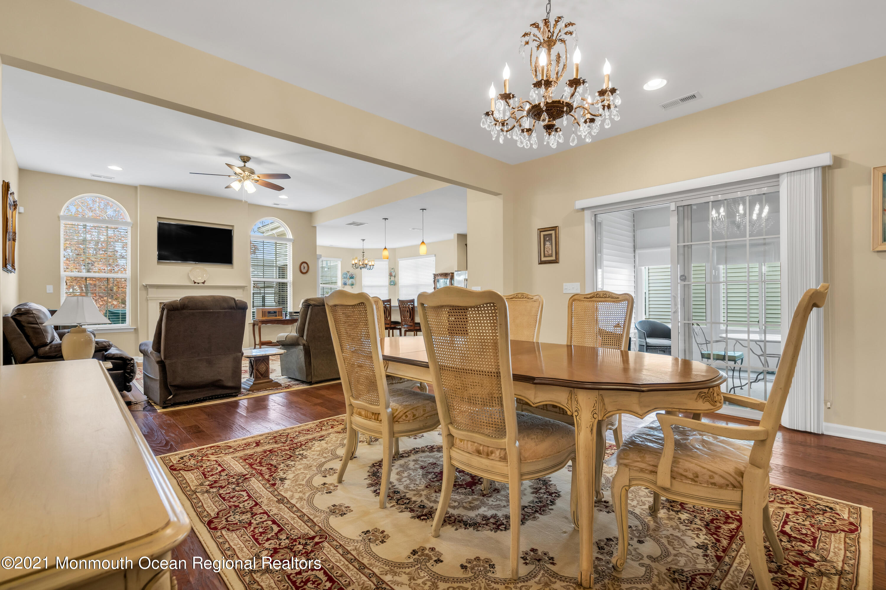 124 Heritage Point Boulevard Barnegat, NJ 08005 - Photo 14 of 56 a view of a dining room with furniture a chandelier and wooden floor