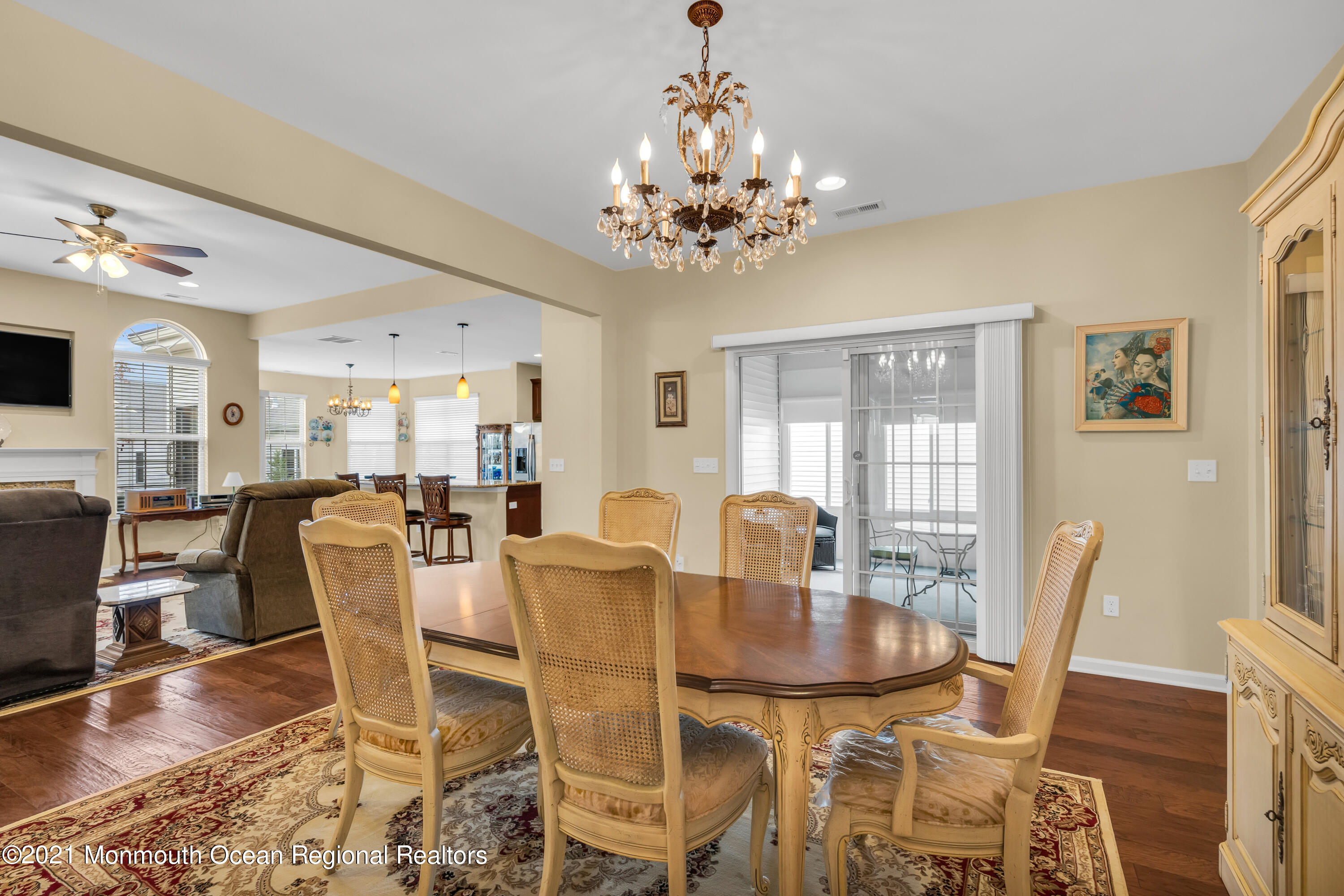 124 Heritage Point Boulevard Barnegat, NJ 08005 - Photo 15 of 56 a dining room with furniture a chandelier and wooden floor