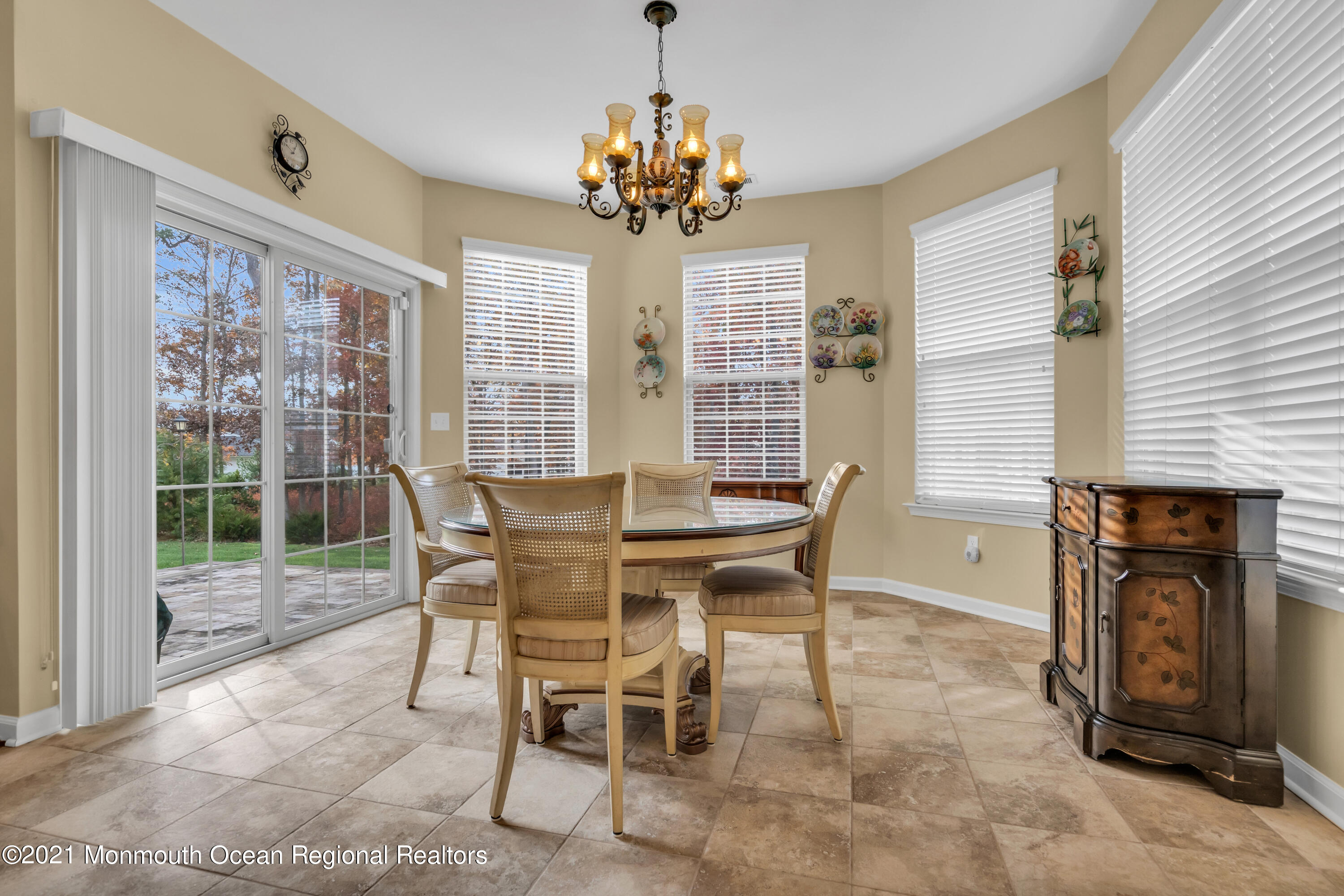124 Heritage Point Boulevard Barnegat, NJ 08005 - Photo 17 of 56 a view of a dining room with furniture wooden floor and chandelier