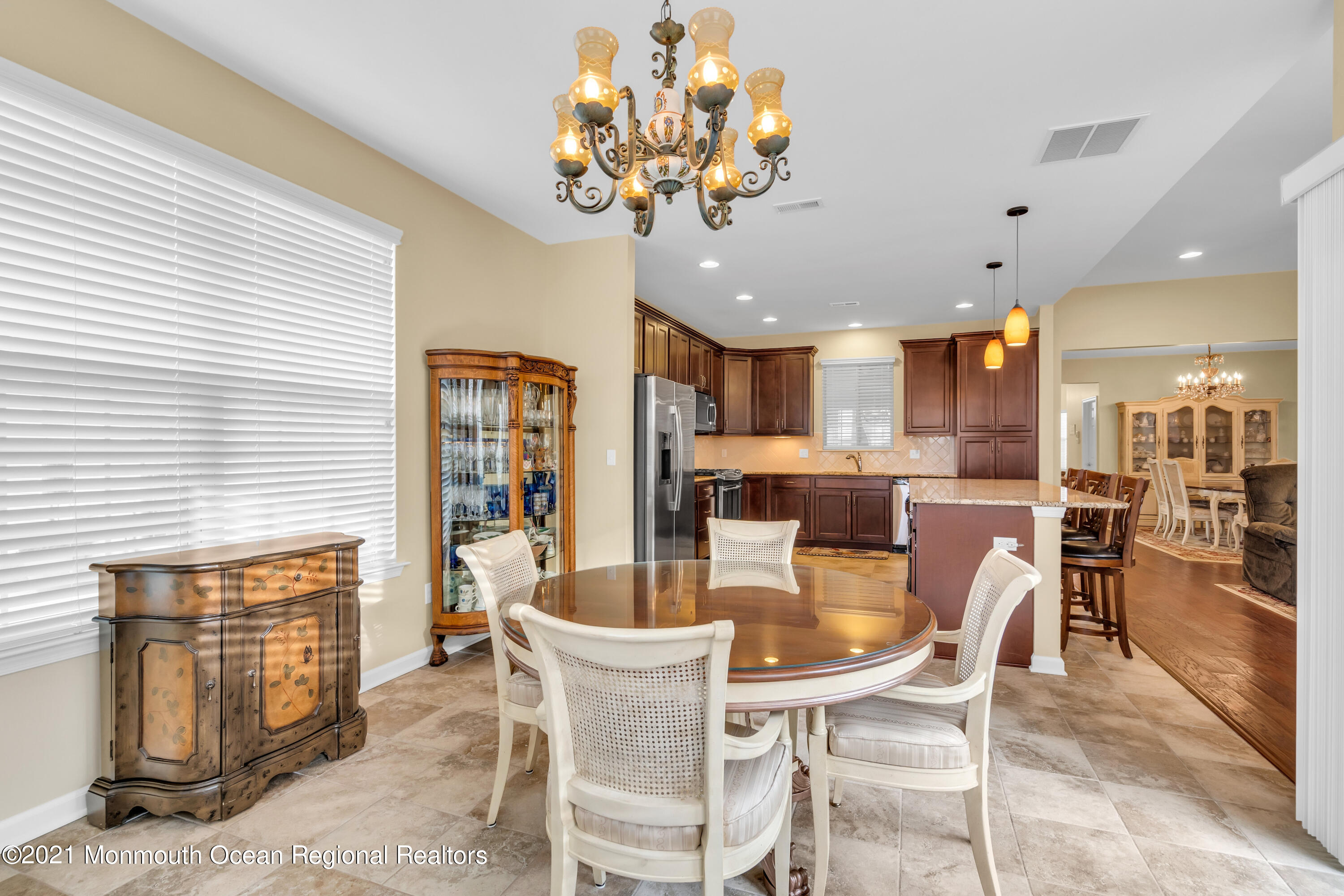 124 Heritage Point Boulevard Barnegat, NJ 08005 - Photo 18 of 56 a dining room with furniture a chandelier and kitchen view