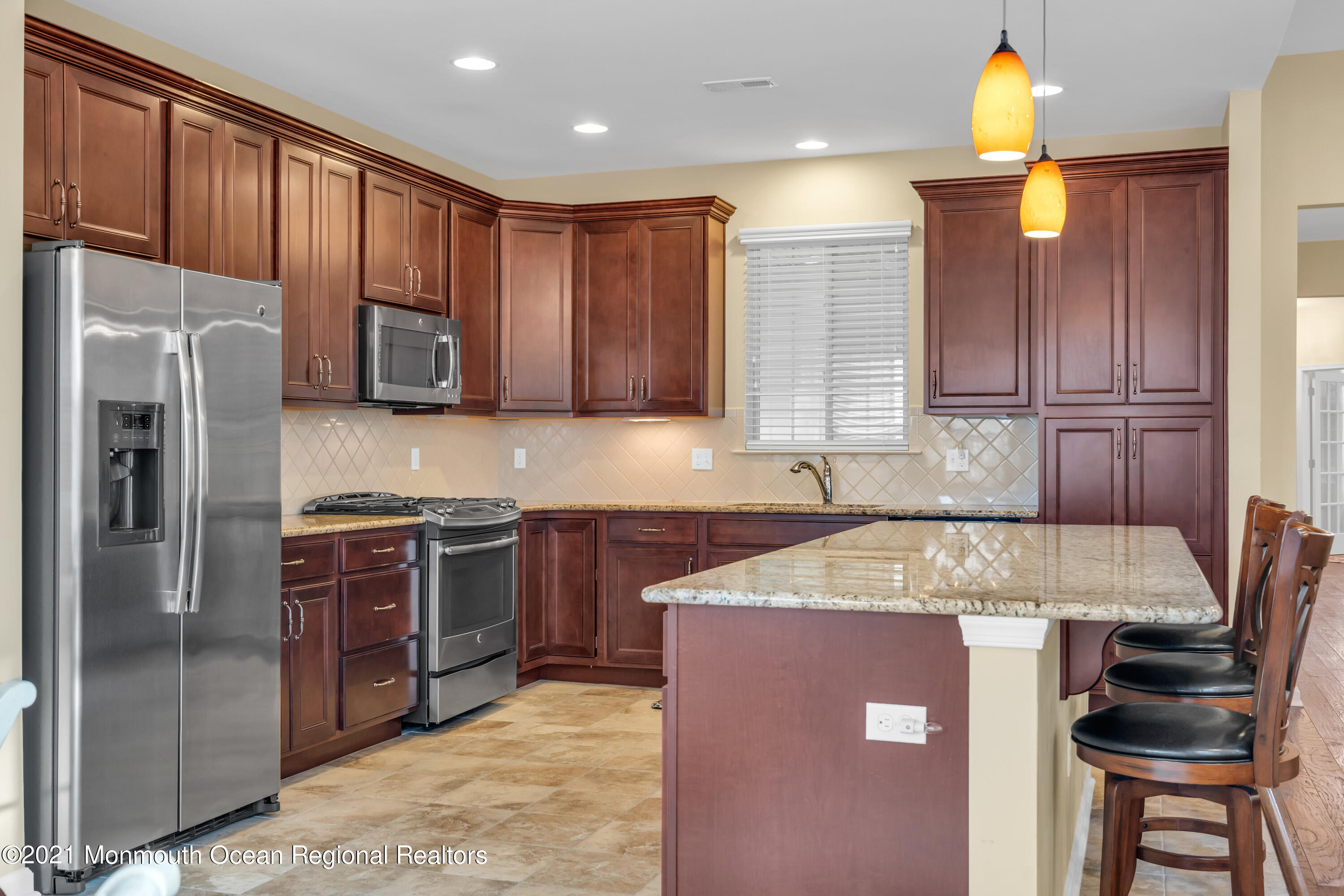 124 Heritage Point Boulevard Barnegat, NJ 08005 - Photo 20 of 56 a kitchen with stainless steel appliances granite countertop a refrigerator sink and cabinets