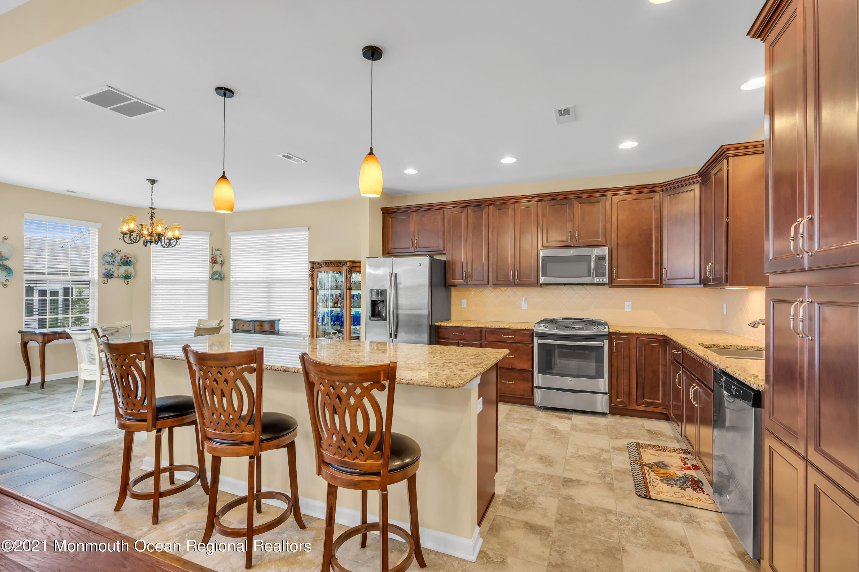 124 Heritage Point Boulevard Barnegat, NJ 08005 - Photo 26 of 56 a large kitchen with a table and chairs