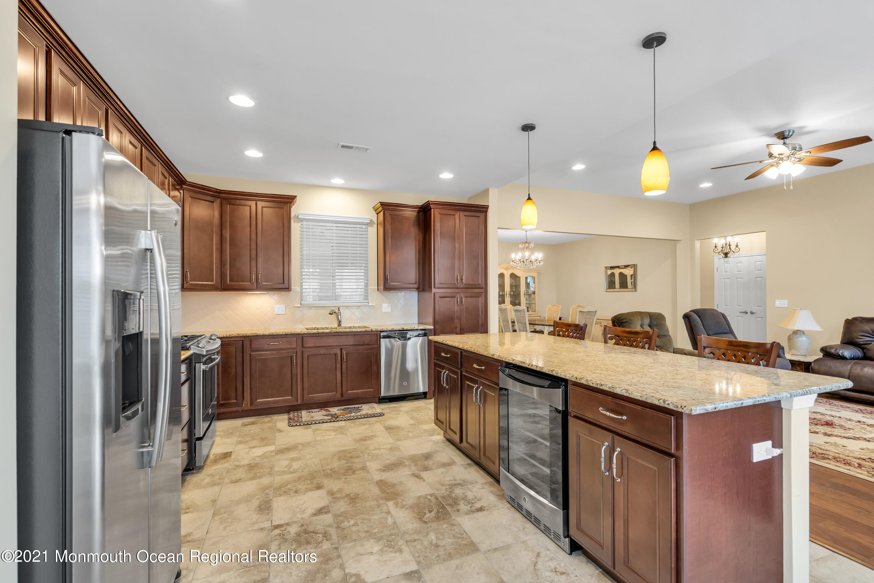 124 Heritage Point Boulevard Barnegat, NJ 08005 - Photo 28 of 56 a large kitchen with kitchen island a sink stainless steel appliances and cabinets