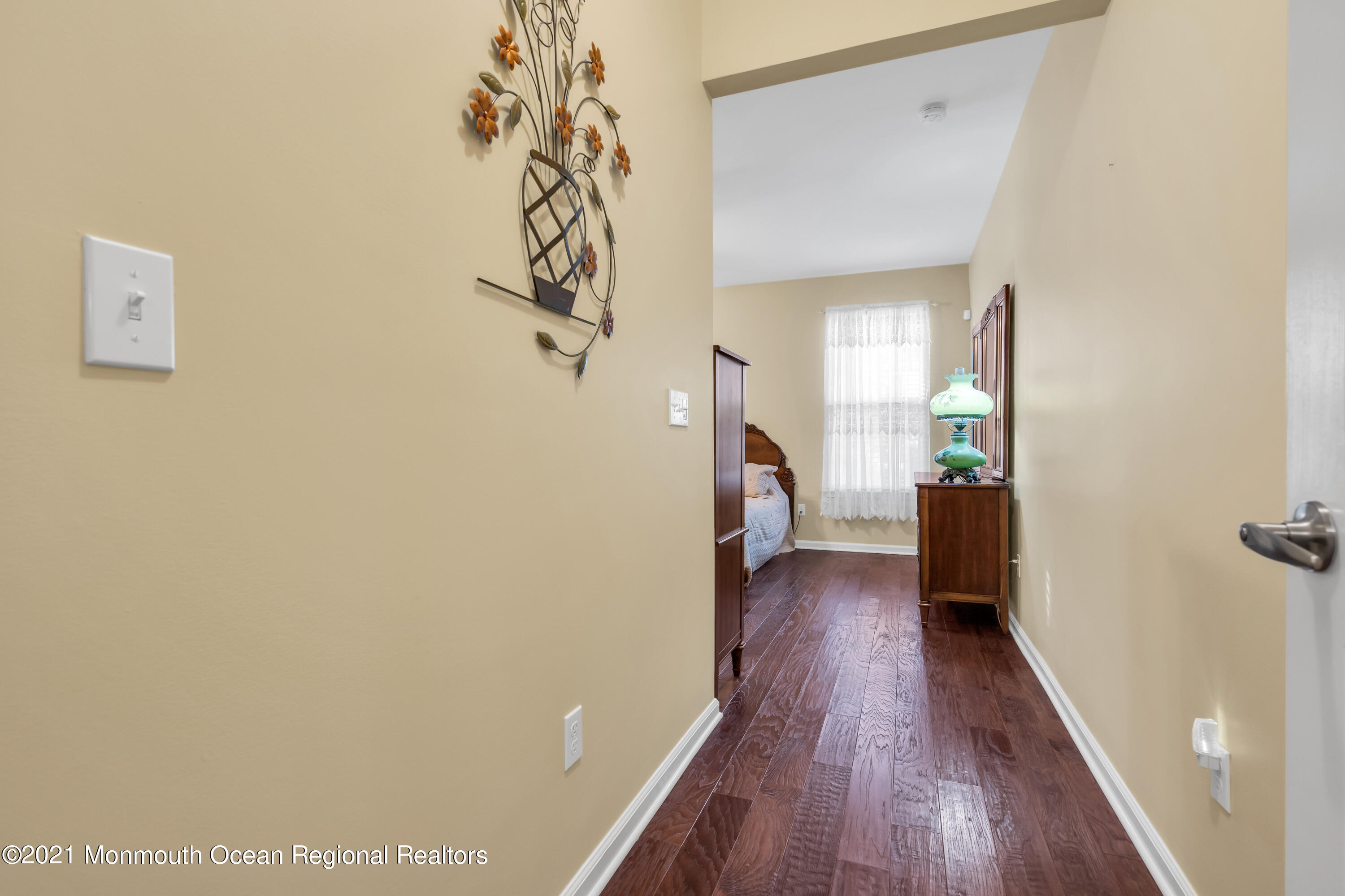 124 Heritage Point Boulevard Barnegat, NJ 08005 - Photo 36 of 56 a view of a hallway with wooden floor and a living room