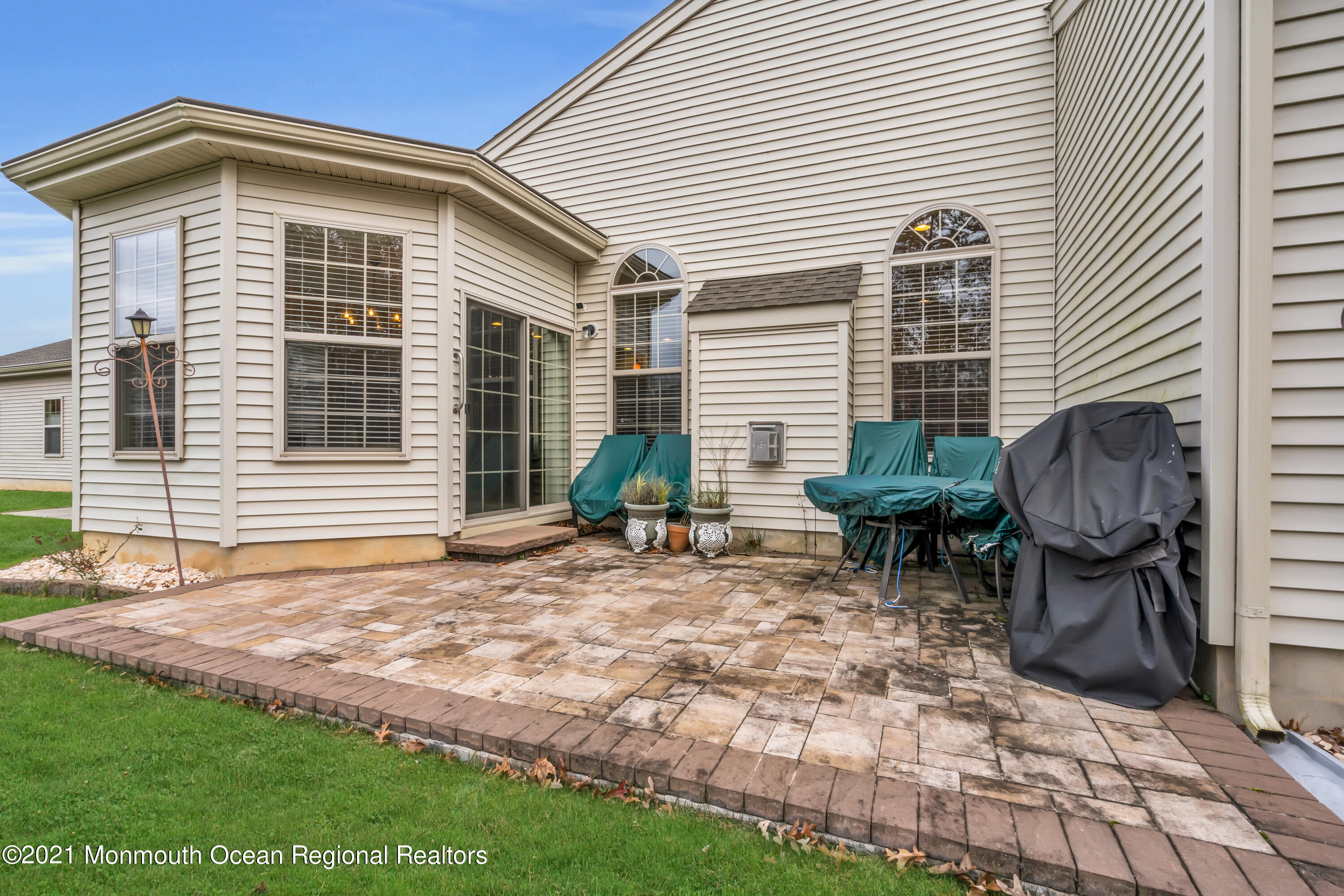 124 Heritage Point Boulevard Barnegat, NJ 08005 - Photo 46 of 56 a backyard of a house with yard and outdoor seating