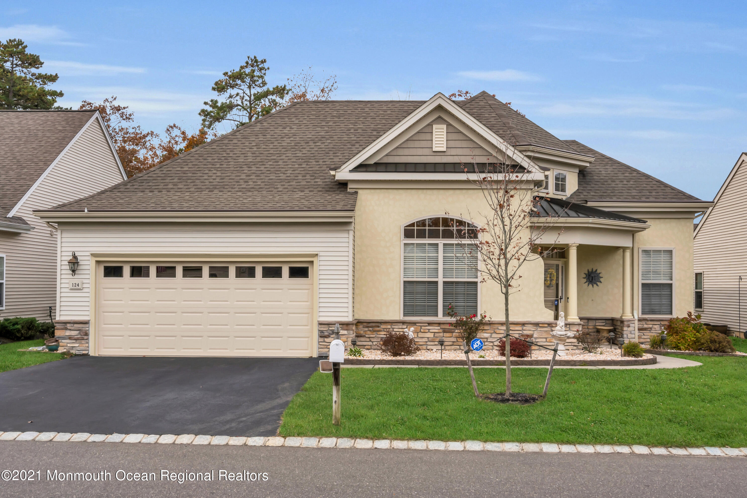 124 Heritage Point Boulevard Barnegat, NJ 08005 - Photo 47 of 56 a front view of a house with a yard