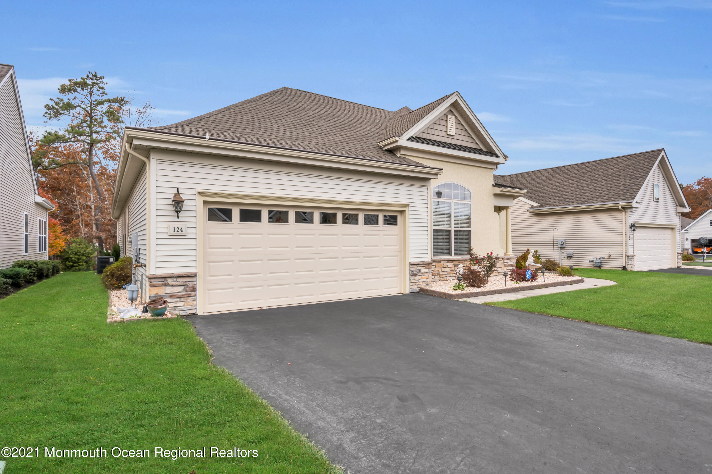 124 Heritage Point Boulevard Barnegat, NJ 08005 - Photo 52 of 56 a front view of a house with a yard and garage